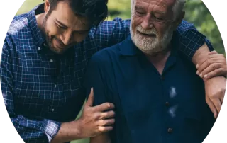 A young man has his arm around his father while they walk together.